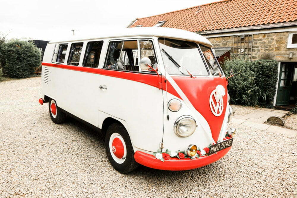 Red and Cream VW Camper Van Classic Wedding Car set up with ribbons bows and roses