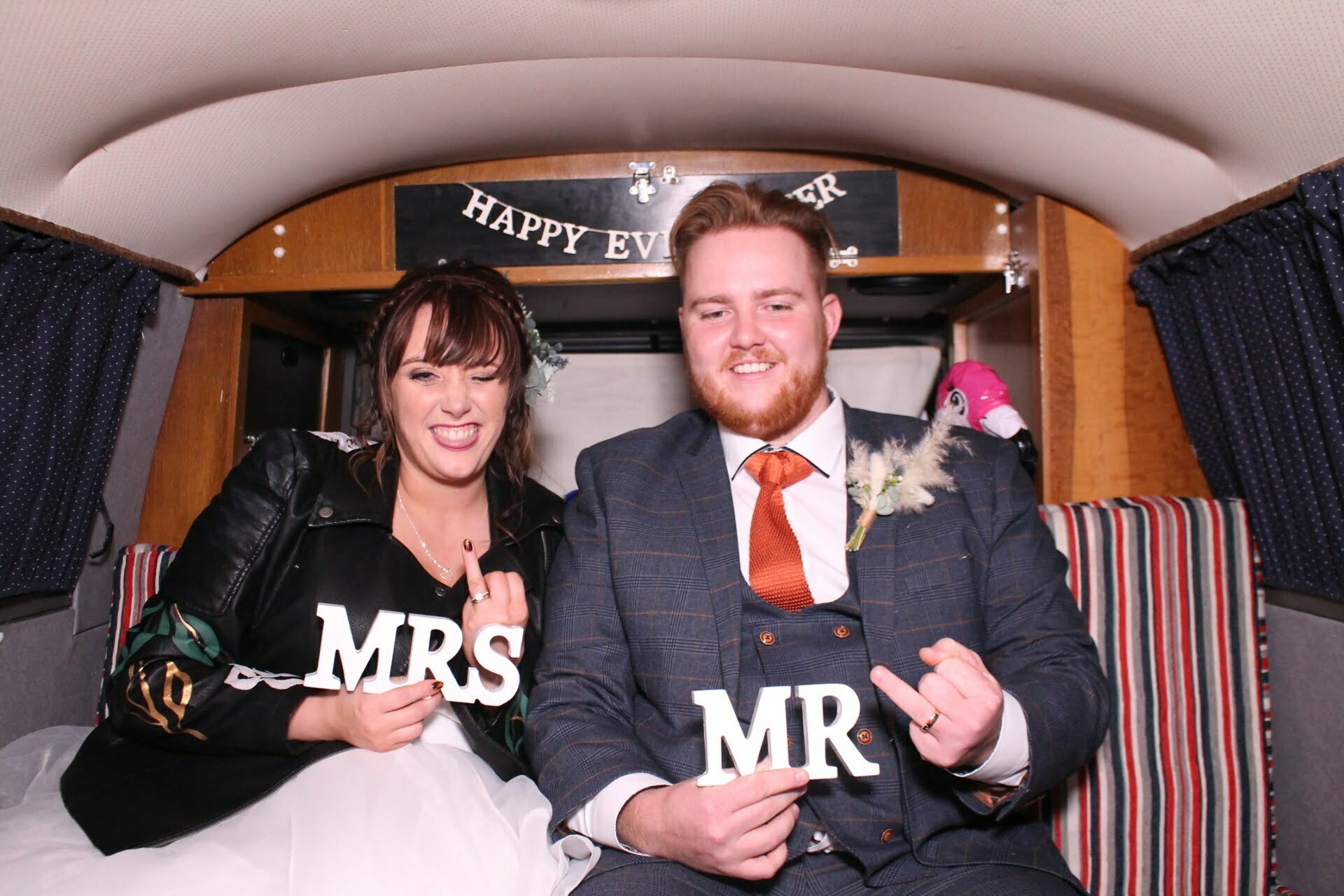 Newlywed having fun in the vw photo booth