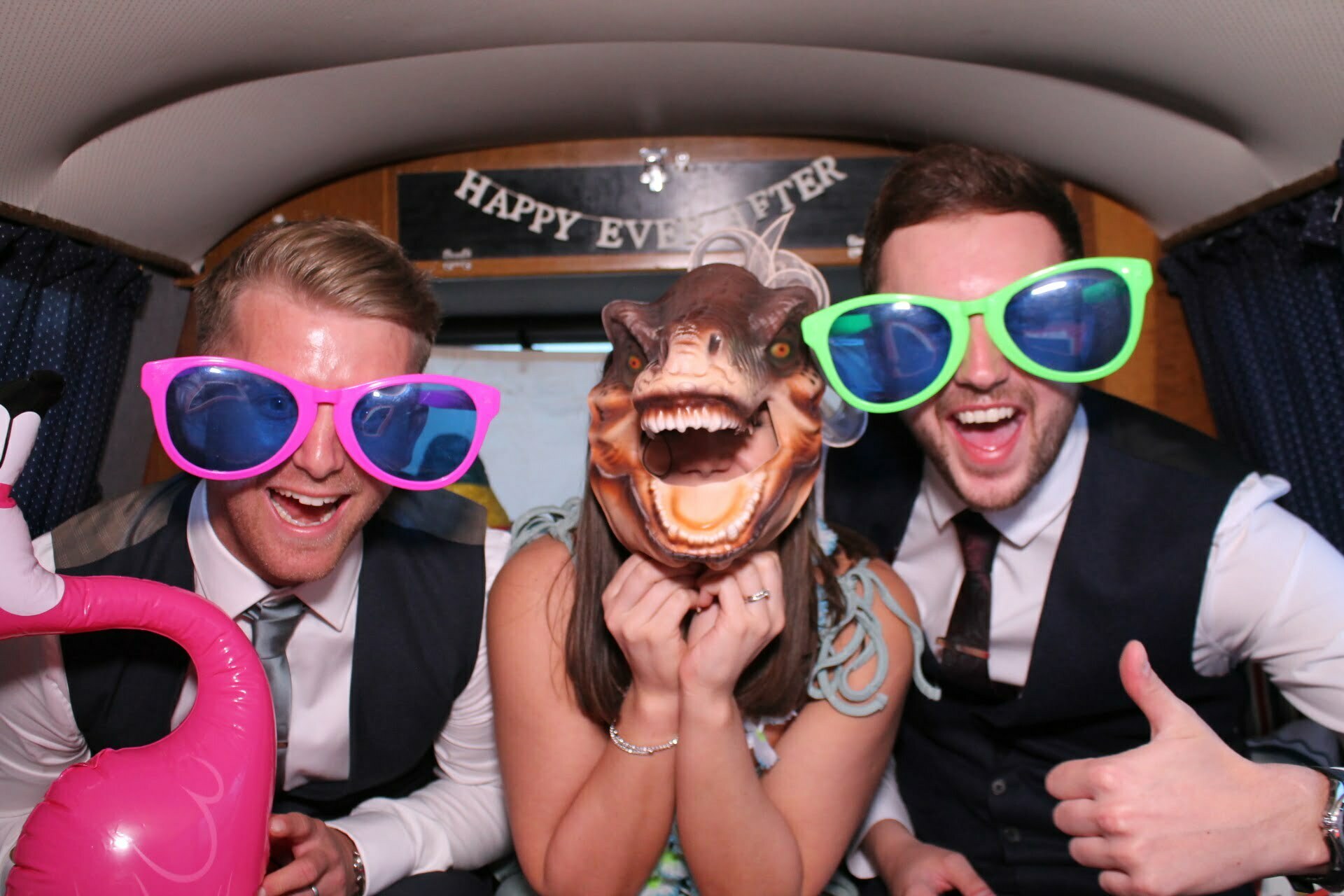Wedding guests having fun in the vw photo booth