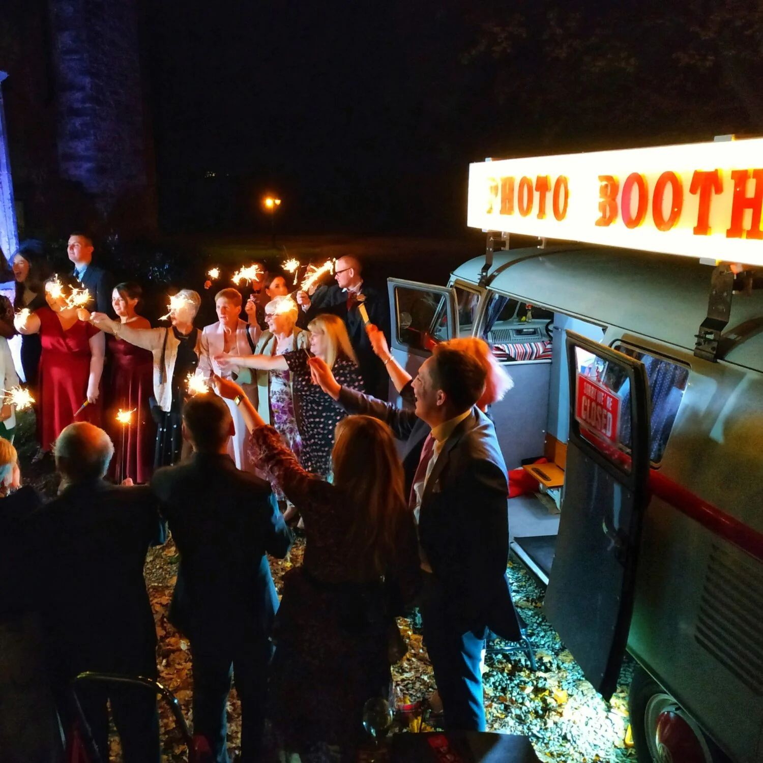 Wedding sparkler photo outside a campervan photo booth