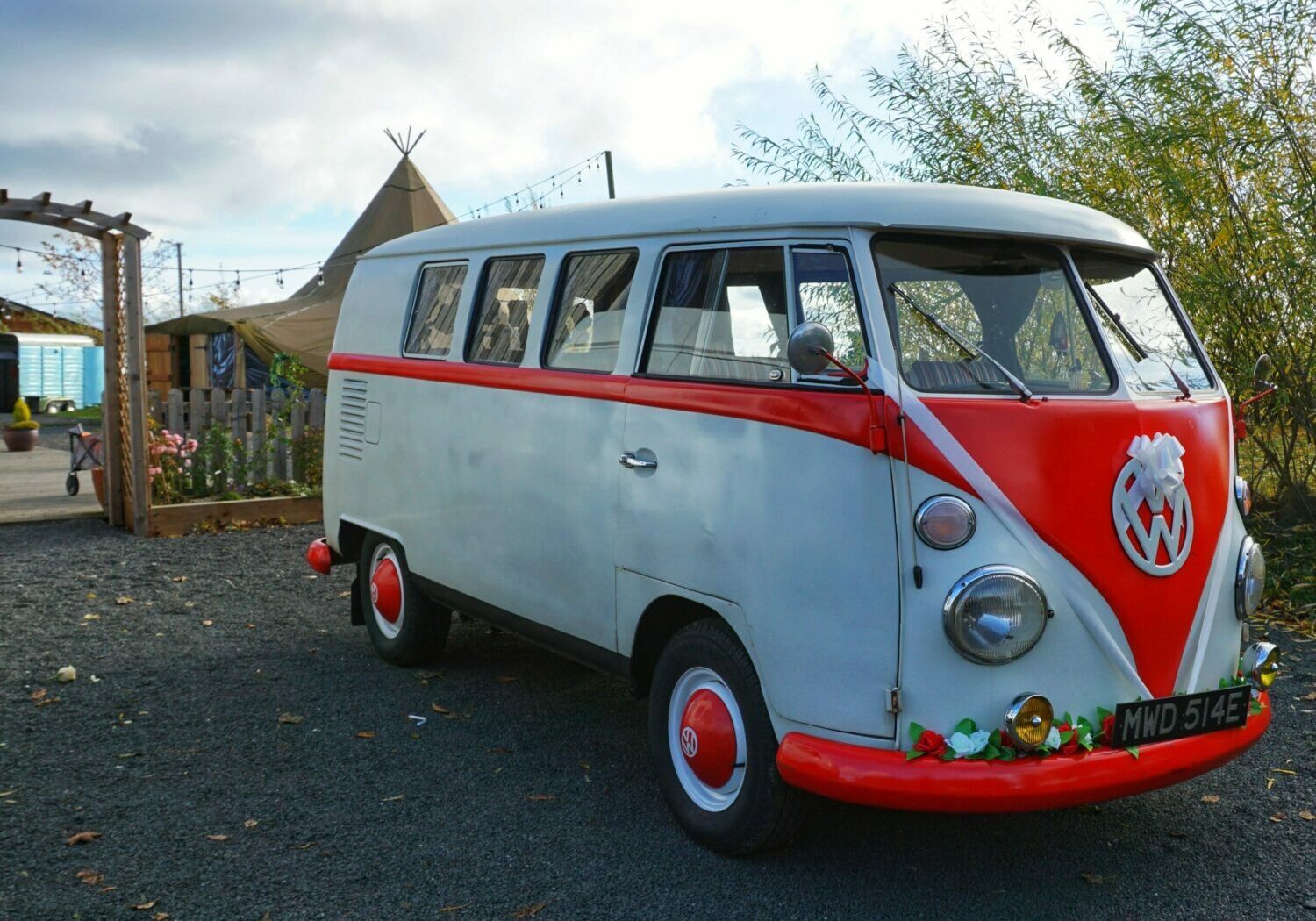 Red and cream split screen campervan wedding car at vallum farm wedding